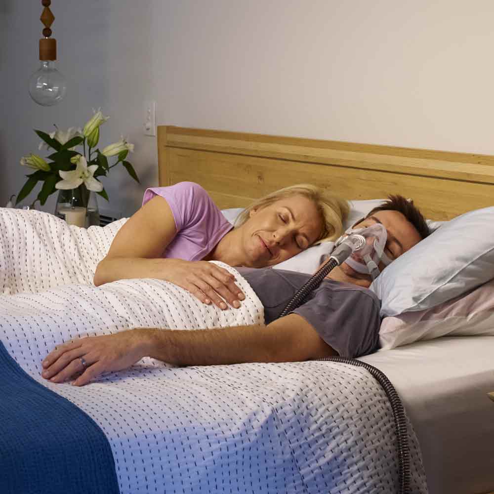 A Man Sleeping with CPAP Macine