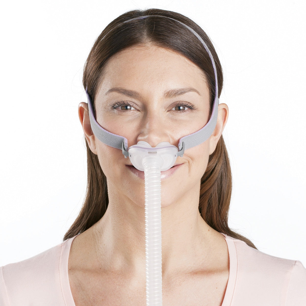 A woman using a CPAP Mask