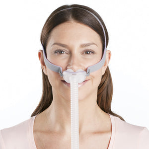 A woman using a CPAP Mask